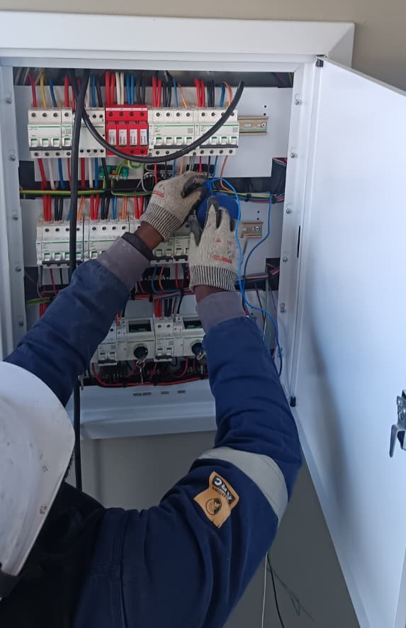 Technician working on an electrical distribution board, from Thy Mash Projects (Pty) Ltd’s website
